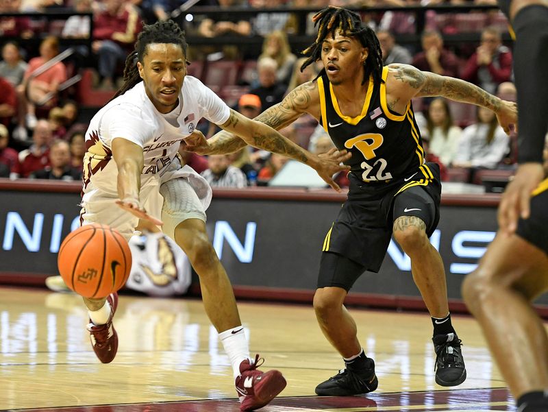 Feb 11, 2023; Tallahassee, Florida, USA; Florida State Seminoles guard Caleb Mills (4) loses the ball as Pittsburgh Panthers guard Nike Sibande (22) defends during the second half at Donald L. Tucker Center. Mandatory Credit: Melina Myers-USA TODAY Sports