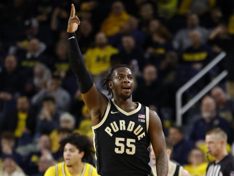 Feb 25, 2024; Ann Arbor, Michigan, USA;  Purdue Boilermakers guard Lance Jones (55) celebrates a three-point basket in the first half against the Michigan Wolverines at Crisler Center. Mandatory Credit: Rick Osentoski-USA TODAY Sports