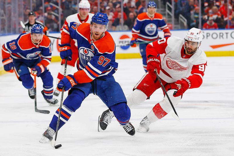 Feb 13, 2024; Edmonton, Alberta, CAN; Edmonton Oilers forward Connor McDavid (97) looks to make a pass in front of Detroit Red Wings forward Joe Veleno (90) during the third period at Rogers Place. Mandatory Credit: Perry Nelson-USA TODAY Sports