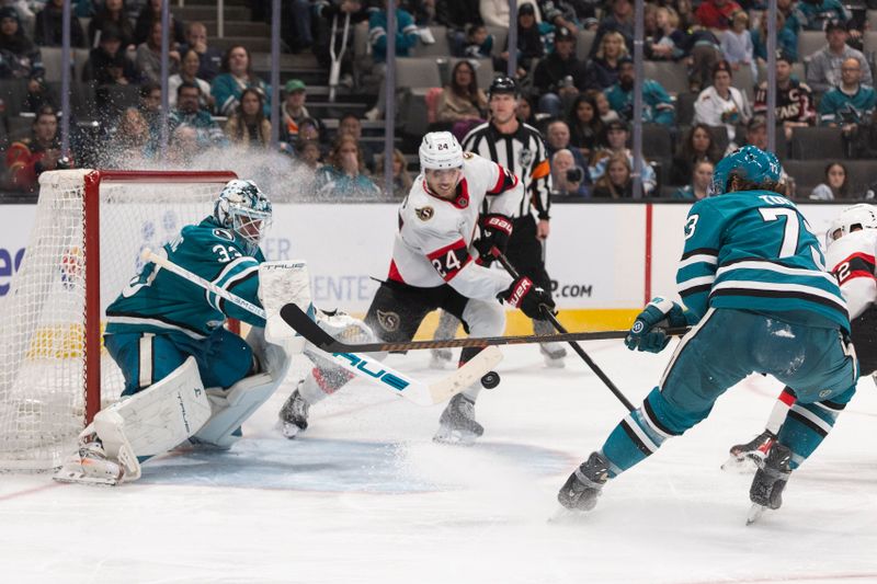 Nov 22, 2025; San Jose, California, USA;  Ottawa Senators center Dylan Cozens (24) attempts to score a goal during the third period against San Jose Sharks goaltender Alex Nedeljkovic (33) at SAP Center at San Jose. Mandatory Credit: Stan Szeto-Imagn Images