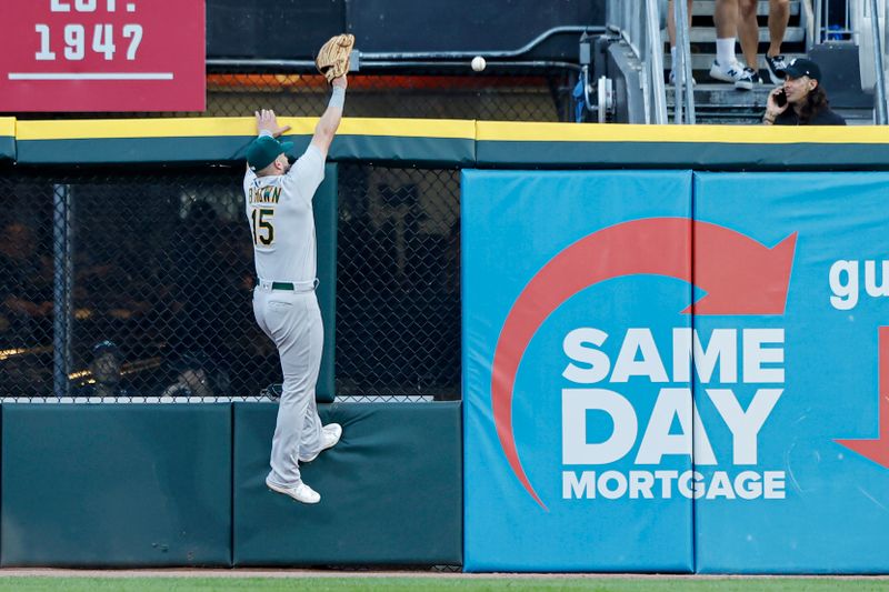 Aug 25, 2023; Chicago, Illinois, USA; Oakland Athletics left fielder Seth Brown (15) is unable to catch a two-run home run hit by Chicago White Sox second baseman Lenyn Sosa during the second inning at Guaranteed Rate Field. Mandatory Credit: Kamil Krzaczynski-USA TODAY Sports