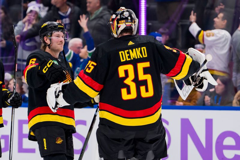 Nov 28, 2023; Vancouver, British Columbia, CAN; Vancouver Canucks forward Brock Boeser (6) and goalie Thatcher Demko (35) celebrate thier victory against the Anaheim Ducks at Rogers Arena. Vancouver won 3-1. Mandatory Credit: Bob Frid-USA TODAY Sports