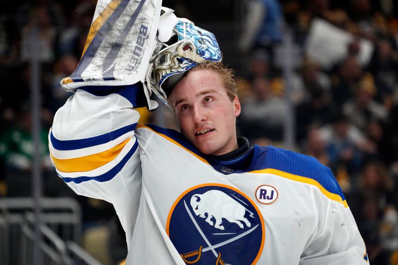 Jan 6, 2024; Pittsburgh, Pennsylvania, USA;  Buffalo Sabres goaltender Ukko-Pekka Luukkonen (1) replaces his mask during the third period against the Pittsburgh Penguins at PPG Paints Arena. Buffalo won 3-1. Mandatory Credit: Charles LeClaire-USA TODAY Sports