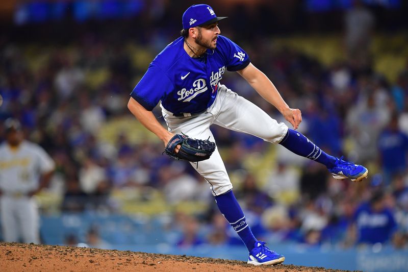 Jul 6, 2023; Los Angeles, California, USA; Los Angeles Dodgers relief pitcher Alex Vesia (51) throws against the Pittsburgh Pirates during the ninth inning at Dodger Stadium. Mandatory Credit: Gary A. Vasquez-USA TODAY Sports