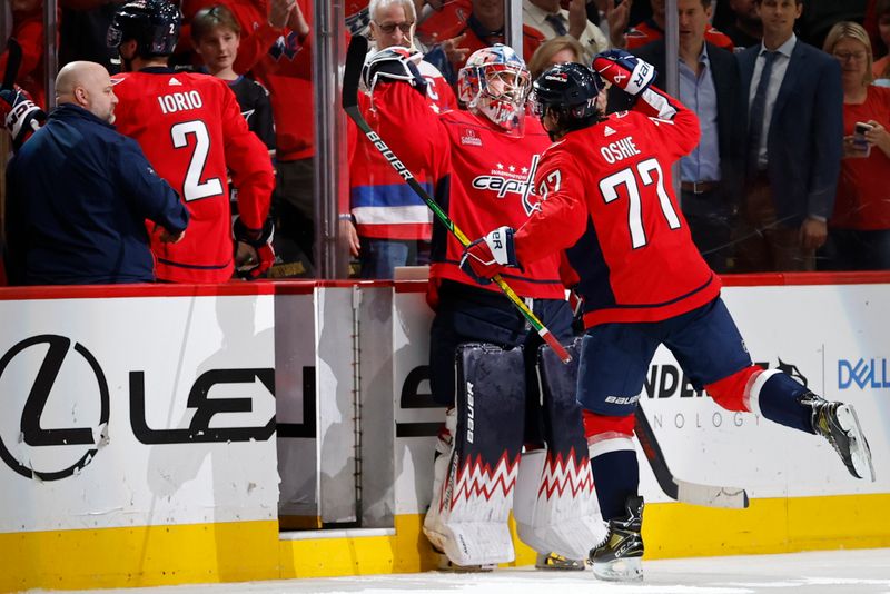 Apr 15, 2024; Washington, District of Columbia, USA; Washington Capitals goaltender Charlie Lindgren (79) celebrates with Capitals right wing T.J. Oshie (77) after their game against the Boston Bruins at Capital One Arena. Mandatory Credit: Geoff Burke-USA TODAY Sports