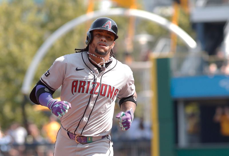 Aug 4, 2024; Pittsburgh, Pennsylvania, USA;  Arizona Diamondbacks second baseman Ketel Marte (4) circles the base on a solo home run against the Pittsburgh Pirates during the ninth inning at PNC Park. Mandatory Credit: Charles LeClaire-USA TODAY Sports