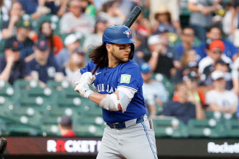 May 24, 2024; Detroit, Michigan, USA; Toronto Blue Jays shortstop Bo Bichette (11) prepares to hit during an at bat in the first inning of the game against the Detroit Tigers at Comerica Park. Mandatory Credit: Brian Bradshaw Sevald-USA TODAY Sports