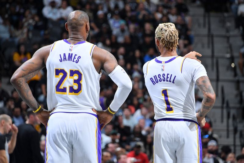 SAN ANTONIO, TX - OCTOBER 22:  LeBron James #23 and D'Angelo Russell #1 of the Los Angeles Lakers look on during the game NBA Cup game against the San Antonio Spurs on October 22, 2024 at the Frost Bank Center in San Antonio, Texas. NOTE TO USER: User expressly acknowledges and agrees that, by downloading and or using this photograph, user is consenting to the terms and conditions of the Getty Images License Agreement. Mandatory Copyright Notice: Copyright 2024 NBAE (Photos by Michael Gonzales/NBAE via Getty Images)