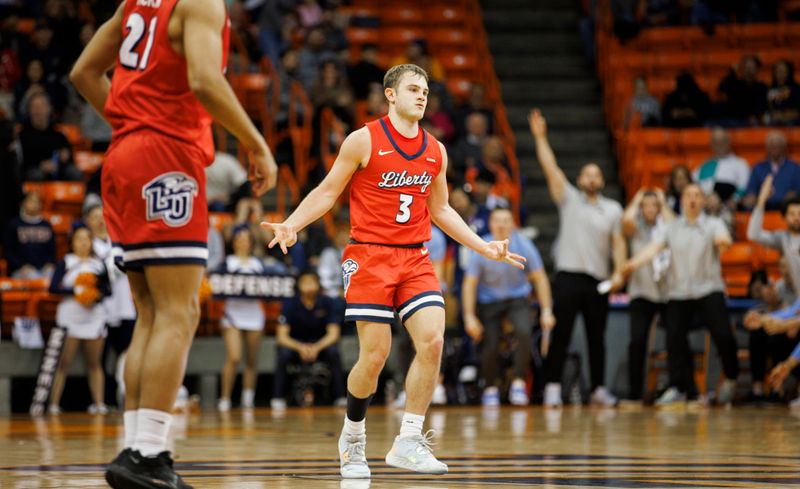 Feb 3, 2024; El Paso, Texas, USA; Liberty University Flames guard Kaden Metheny (3) celebrates after scoring a three pointer against the UTEP Miners defense in the first half at Don Haskins Center. Mandatory Credit: Ivan Pierre Aguirre-USA TODAY Sports