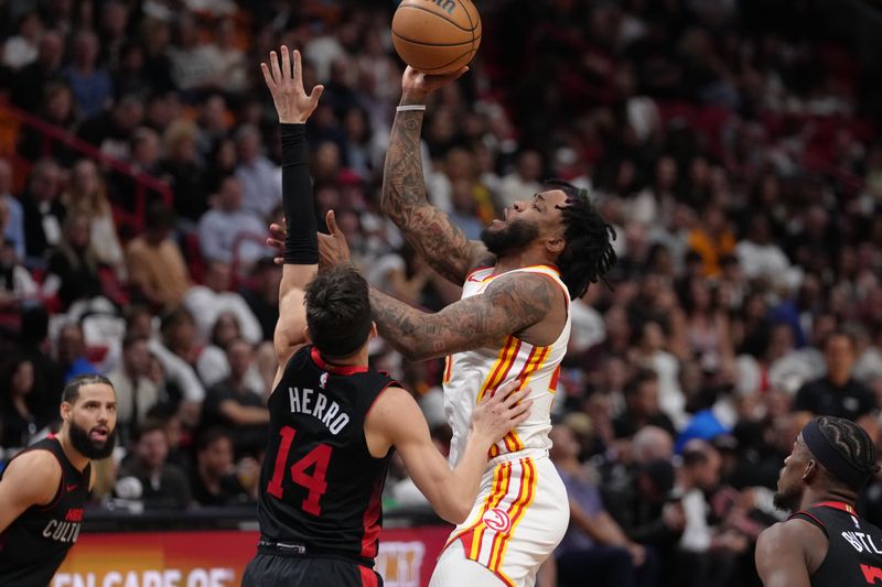 MIAMI, FL - JANUARY 19: Saddiq Bey #41 of the Atlanta Hawks shoots the ball during the game against the Miami Heat on January 19, 2024 at Kaseya Center in Miami, Florida. NOTE TO USER: User expressly acknowledges and agrees that, by downloading and or using this Photograph, user is consenting to the terms and conditions of the Getty Images License Agreement. Mandatory Copyright Notice: Copyright 2024 NBAE (Photo by Eric Espada/NBAE via Getty Images)