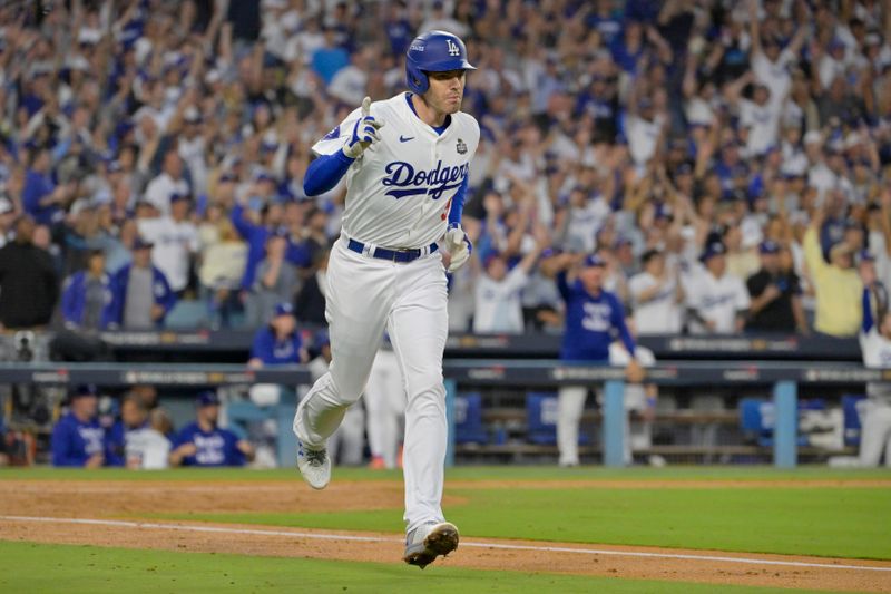 Oct 26, 2024; Los Angeles, California, USA; Los Angeles Dodgers first baseman Freddie Freeman (5) reacts after hitting a solo home run in the third inning against the New York Yankees during game two of the 2024 MLB World Series at Dodger Stadium. Mandatory Credit: Jayne Kamin-Oncea-Imagn Images