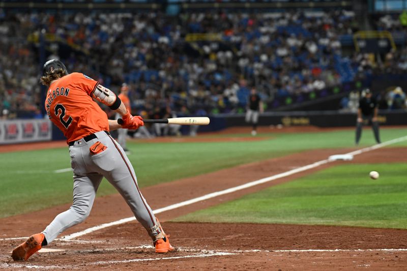 Aug 10, 2024; St. Petersburg, Florida, USA; Baltimore Orioles shortstop Gunnar Henderson (2) singles  in the fifth inning against the Tampa Bay Rays at Tropicana Field. Mandatory Credit: Jonathan Dyer-USA TODAY Sports