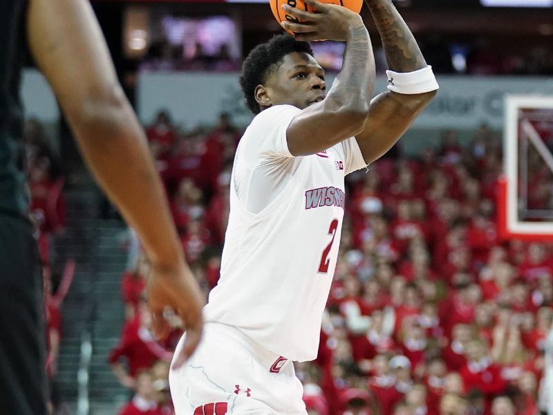 Jan 26, 2024; Madison, Wisconsin, USA; Wisconsin Badgers guard AJ Storr (2) shoots a three point basket during the second half against the Wisconsin Badgers at the Kohl Center. Mandatory Credit: Kayla Wolf-USA TODAY Sports