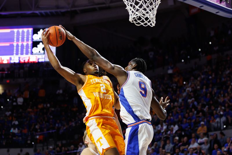 Jan 7, 2025; Gainesville, Florida, USA; Florida Gators center Rueben Chinyelu (9) blocks a layup from Tennessee Volunteers guard Chaz Lanier (2) during the first half at Exactech Arena at the Stephen C. O'Connell Center. Mandatory Credit: Matt Pendleton-Imagn Images