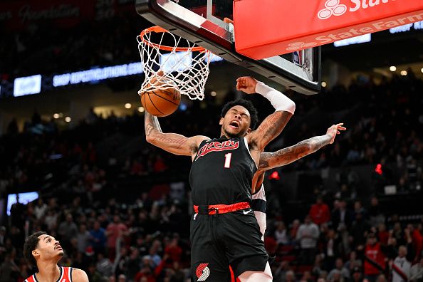 PORTLAND, OREGON - DECEMBER 21: Anfernee Simons #1 of the Portland Trail Blazers dunks during the fourth quarter of the game against the Washington Wizards at the Moda Center on December 21, 2023 in Portland, Oregon. The Washington Wizards won 118-117. NOTE TO USER: User expressly acknowledges and agrees that, by downloading and or using this photograph, User is consenting to the terms and conditions of the Getty Images License Agreement. (Photo by Alika Jenner/Getty Images)