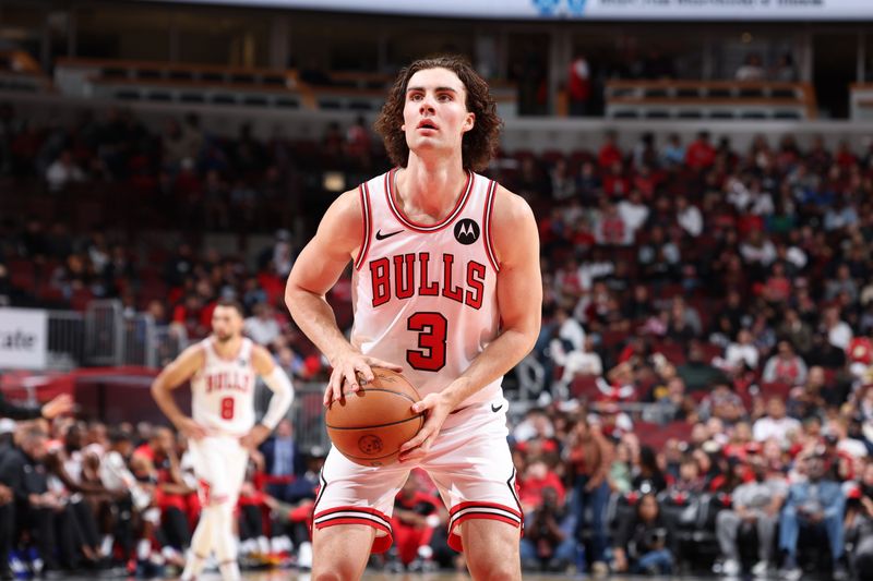 CHICAGO, IL - OCTOBER 12: Josh Giddey #3 of the Chicago Bulls shoots a free throw during the game against the Memphis Grizzlies during a NBA preseason game on October 12, 2024 at United Center in Chicago, Illinois. NOTE TO USER: User expressly acknowledges and agrees that, by downloading and or using this photograph, User is consenting to the terms and conditions of the Getty Images License Agreement. Mandatory Copyright Notice: Copyright 2024 NBAE (Photo by Jeff Haynes/NBAE via Getty Images)