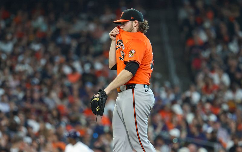 Jun 22, 2024; Houston, Texas, USA; Baltimore Orioles starting pitcher Corbin Burnes (39) reacts after a pitch during the seventh inning against the Houston Astros at Minute Maid Park. Mandatory Credit: Troy Taormina-USA TODAY Sports