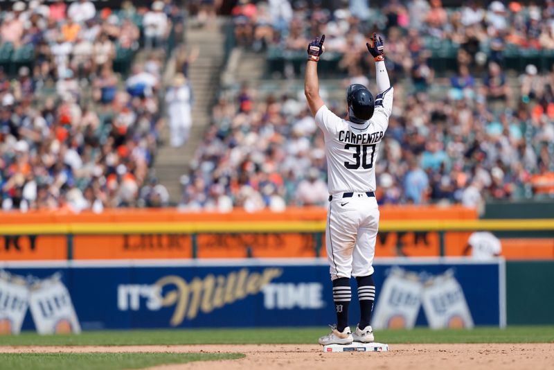 Jun 8, 2025; Detroit, Michigan, USA;  Detroit Tigers outfielder Kerry Carpenter (30) celebrates after he hits a double in the seventh inning against the Chicago Cubs at Comerica Park. Mandatory Credit: Rick Osentoski-Imagn Images