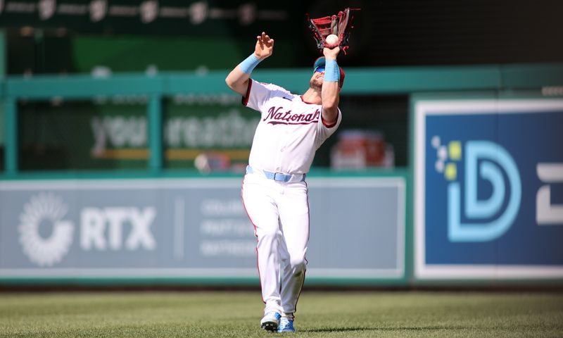 Jun 16, 2024; Washington, District of Columbia, USA; Washington Nationals outfielder Lane Thomas (28) makes a catch for an out during the ninth inning in a game against the Miami Marlins at Nationals Park. Mandatory Credit: Daniel Kucin Jr.-USA TODAY Sports