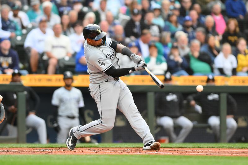 Jun 11, 2024; Seattle, Washington, USA; Chicago White Sox catcher Martin Maldonado (15) hits a single against the Seattle Mariners during the second inning at T-Mobile Park. Mandatory Credit: Steven Bisig-USA TODAY Sports