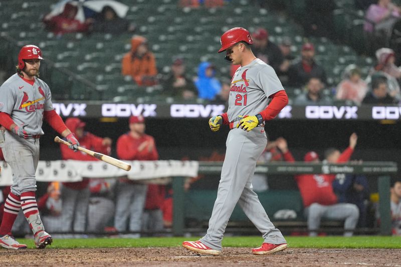 May 28, 2025; Baltimore, Maryland, USA; St. Louis Cardinals left fielder Lars Nootbaar (21) scores a run on St. Louis Cardinals shortstop Masyn Winn (0) (not pictured) RBI double against the Baltimore Orioles during the fifth inning at Oriole Park at Camden Yards. Mandatory Credit: Gregory Fisher-Imagn Images