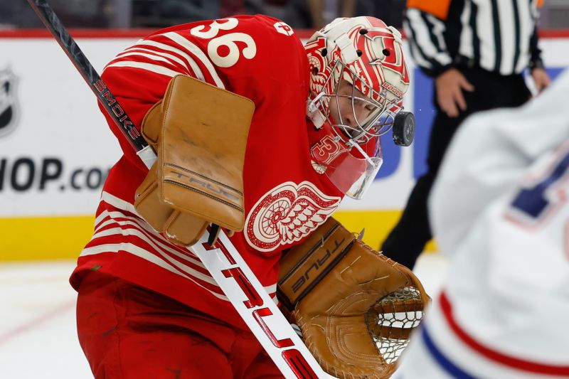 Oct 9, 2025; Detroit, Michigan, USA;  Detroit Red Wings goaltender John Gibson (36) makes the save in the first period against the Montréal Canadiens at Little Caesars Arena. Mandatory Credit: Rick Osentoski-Imagn Images