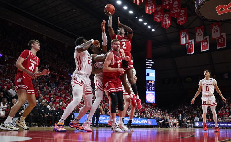 Feb 10, 2024; Piscataway, New Jersey, USA; Wisconsin Badgers guard AJ Storr (2) drives for a shot against Rutgers Scarlet Knights center Emmanuel Ogbole (22) during the first half at Jersey Mike's Arena. Mandatory Credit: Vincent Carchietta-USA TODAY Sports