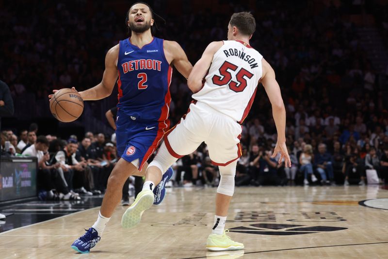 MIAMI, FLORIDA - OCTOBER 28: Cade Cunningham #2 of the Detroit Pistons collides with Duncan Robinson #55 of the Miami Heat during the first half at Kaseya Center on October 28, 2024 in Miami, Florida. NOTE TO USER: User expressly acknowledges and agrees that, by downloading and or using this photograph, User is consenting to the terms and conditions of the Getty Images License Agreement. (Photo by Carmen Mandato/Getty Images)