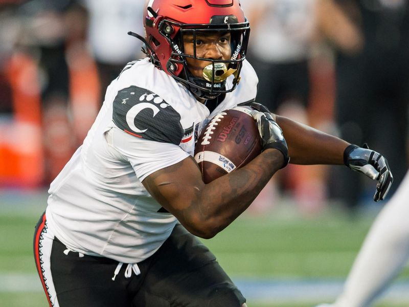 Oct 1, 2022; Tulsa, Oklahoma, USA;  Cincinnati Bearcats running back Corey Kiner (2) runs during the first quarter against the Tulsa Golden Hurricane at Skelly Field at H.A. Chapman Stadium. Cincinnati won 31-21. Mandatory Credit: Brett Rojo-USA TODAY Sports