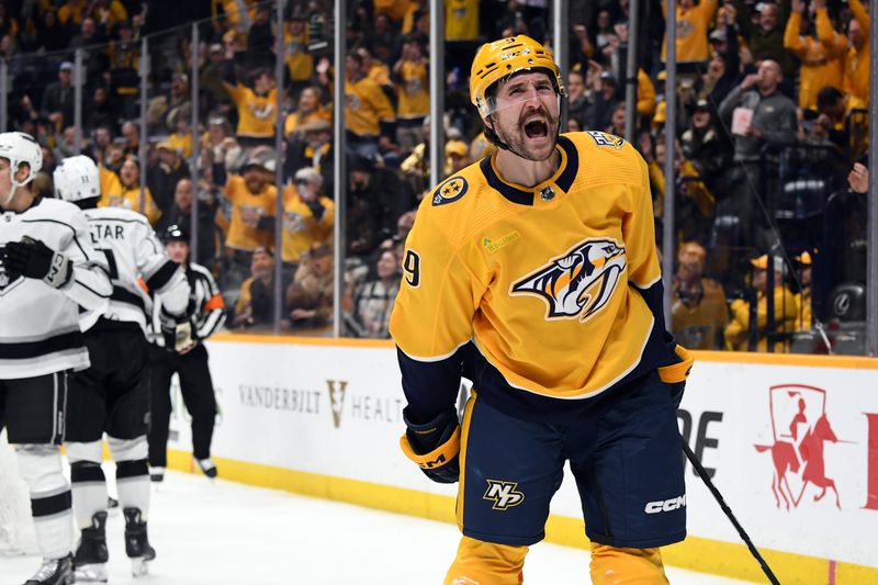 Jan 31, 2024; Nashville, Tennessee, USA; Nashville Predators left wing Filip Forsberg (9) celebrates after a goal during the third period against the Los Angeles Kings at Bridgestone Arena. Mandatory Credit: Christopher Hanewinckel-USA TODAY Sports