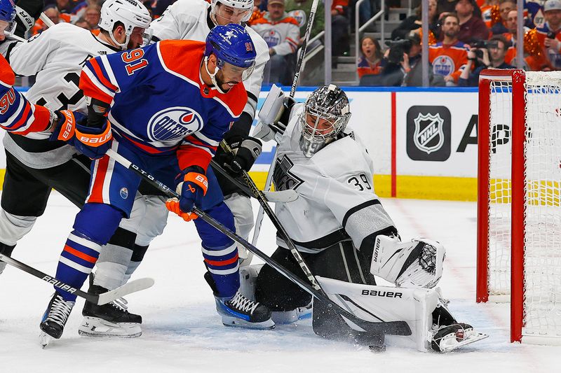 Apr 22, 2024; Edmonton, Alberta, CAN; Edmonton Oilers forward Evander Kane (91) tries to knock a rebound past Los Angeles Kings goaltender Cam Talbot (39) during the first period in game one of the first round of the 2024 Stanley Cup Playoffs at Rogers Place. Mandatory Credit: Perry Nelson-USA TODAY Sports