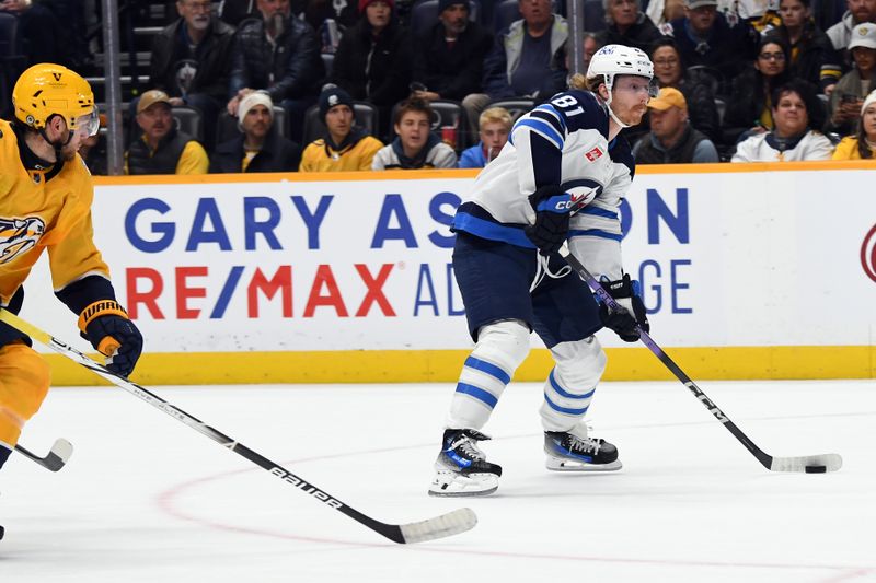 Nov 26, 2023; Nashville, Tennessee, USA; Winnipeg Jets left wing Kyle Connor (81) skates with the puck during the second period against the Nashville Predators at Bridgestone Arena. Mandatory Credit: Christopher Hanewinckel-USA TODAY Sports