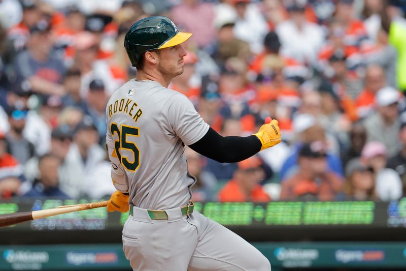 Apr 6, 2024; Detroit, Michigan, USA;  Oakland Athletics left fielder Brent Rooker (25) hits an RBI single against the Detroit Tigers in the eighth inning at Comerica Park. Mandatory Credit: Rick Osentoski-USA TODAY Sports