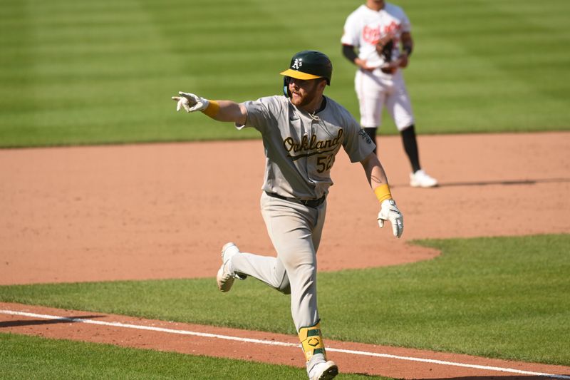 Apr 28, 2024; Baltimore, Maryland, USA;  Oakland Athletics catcher Kyle McCann (52) reacts after hitting a two-run home run during the ninth inning against the Baltimore Orioles at Oriole Park at Camden Yards. Mandatory Credit: James A. Pittman-USA TODAY Sports