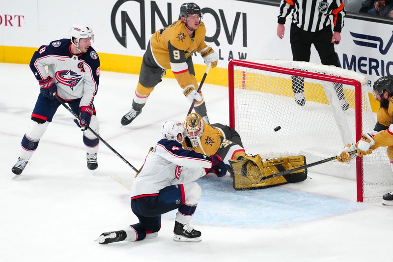 Jan 30, 2025; Las Vegas, Nevada, USA; Columbus Blue Jackets center Cole Sillinger (4) scores a goal against Vegas Golden Knights goaltender Ilya Samsonov (35) during an over time period to give the Blue Jackets a 2-1 victory at T-Mobile Arena. Mandatory Credit: Stephen R. Sylvanie-Imagn Images