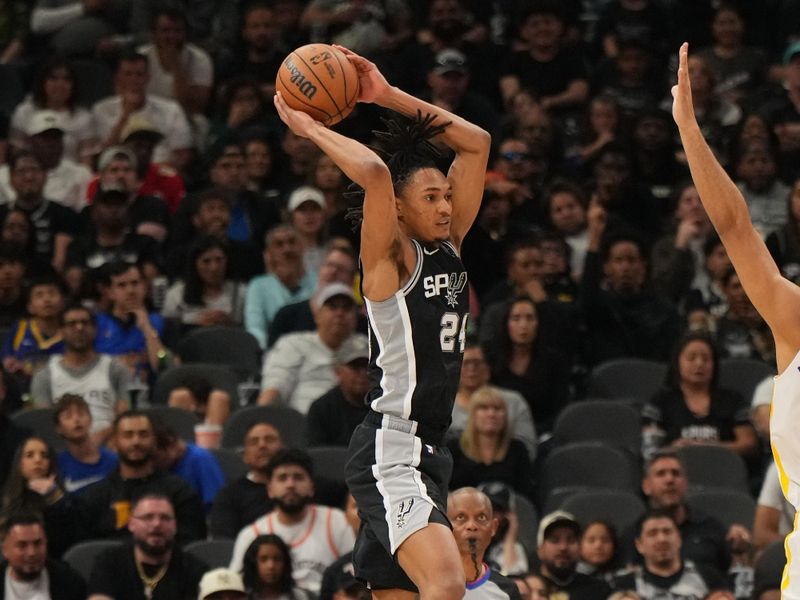 SAN ANTONIO, TX - MARCH 11: Devin Vassell #24 of the San Antonio Spurs passes the ball during the game against the Golden State Warriors on March 11, 2024 at the AT&T Center in San Antonio, Texas. NOTE TO USER: User expressly acknowledges and agrees that, by downloading and or using this photograph, user is consenting to the terms and conditions of the Getty Images License Agreement. Mandatory Copyright Notice: Copyright 2024 NBAE (Photos by Jesse D. Garrabrant/NBAE via Getty Images)