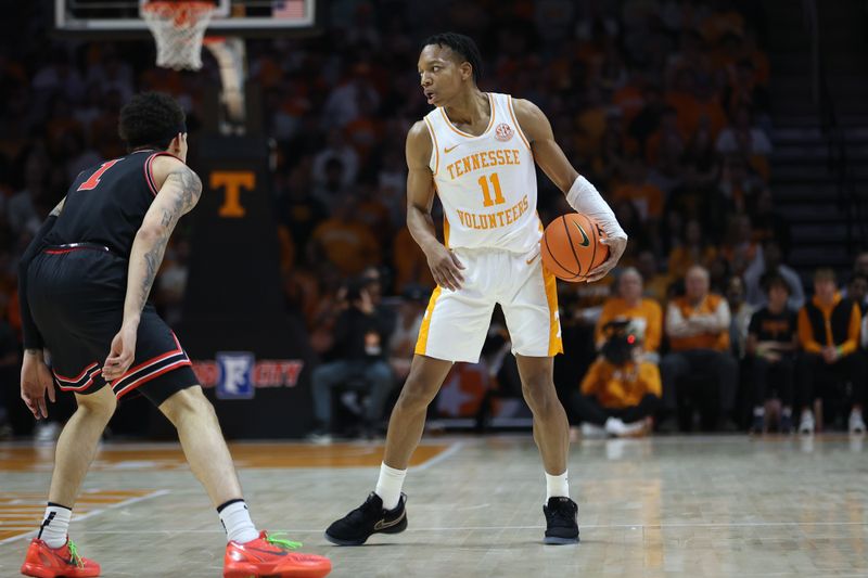 Jan 15, 2025; Knoxville, Tennessee, USA; Tennessee Volunteers guard Jordan Gainey (11) holds the ball against the Georgia Bulldogs during the first half at Thompson-Boling Arena at Food City Center. Mandatory Credit: Randy Sartin-Imagn Images