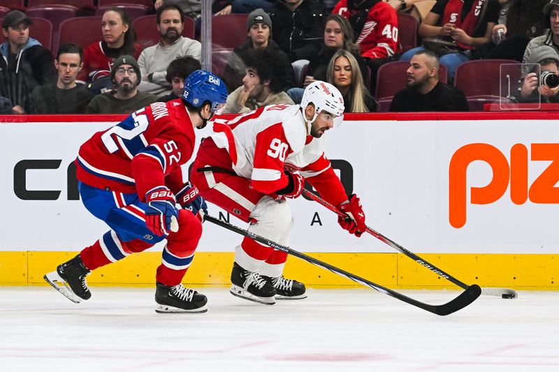 Dec 2, 2023; Montreal, Quebec, CAN; Montreal Canadiens defenseman Justin Barron (52) defends against Detroit Red Wings center Joe Veleno (90) during the second period at Bell Centre. Mandatory Credit: David Kirouac-USA TODAY Sports