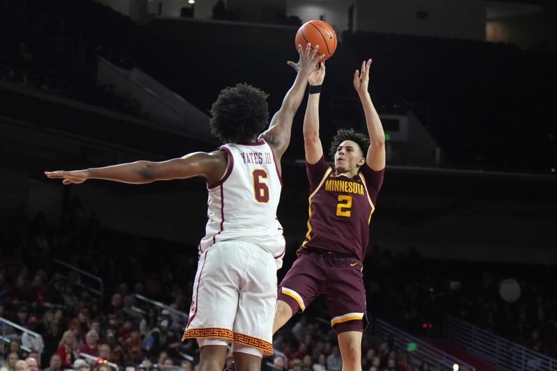 Feb 15, 2025; Los Angeles, California, USA; Minnesota Golden Gophers guard Mike Mitchell Jr. (2) shoots the ball against Southern California Trojans guard Wesley Yates III (6) in the first half at Galen Center. Mandatory Credit: Kirby Lee-Imagn Images