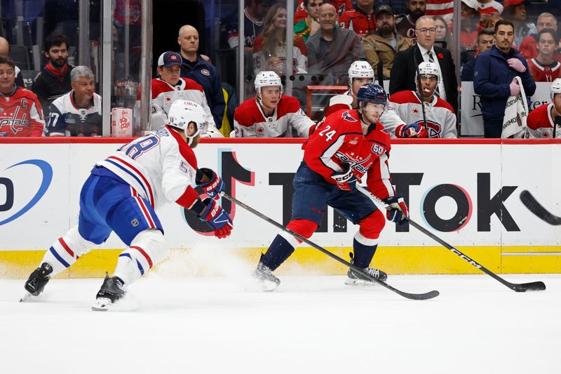 Oct 31, 2024; Washington, District of Columbia, USA; Washington Capitals center Connor McMichael (24) skates with the puck as /Montreal Canadiens defenseman David Savard (58) defends in the first period at Capital One Arena. Mandatory Credit: Geoff Burke-Imagn Images