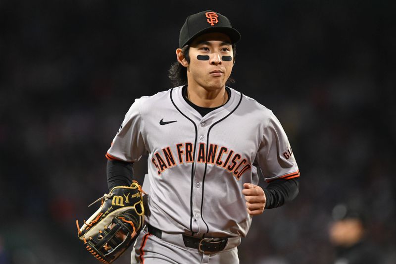 Apr 30, 2024; Boston, Massachusetts, USA; San Francisco Giants center fielder Jung Hoo Lee (51) runs off of the field after the end of the sixth inning of a game against the Boston Red Sox at Fenway Park. Mandatory Credit: Brian Fluharty-USA TODAY Sports