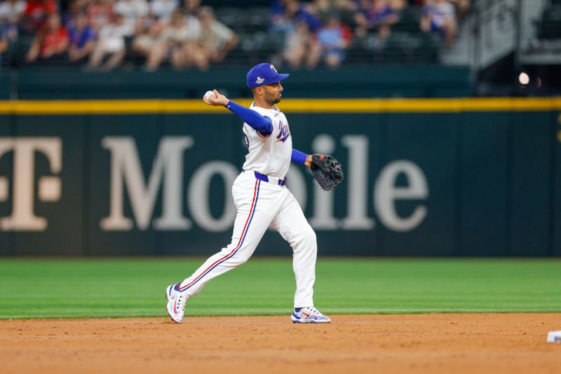 Jun 4, 2024; Arlington, Texas, USA; Texas Rangers second base Marcus Semien (2) throws over to first during the second inning against the Detroit Tigers at Globe Life Field. Mandatory Credit: Andrew Dieb-USA TODAY Sports