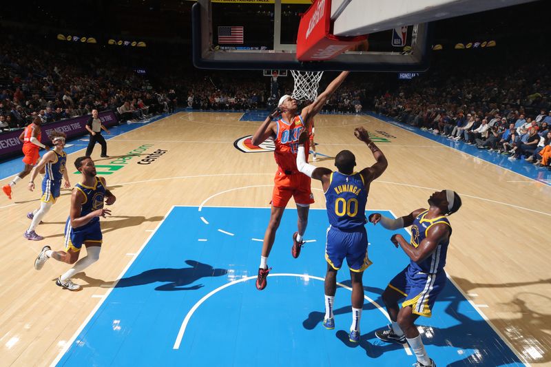 OKLAHOMA CITY, OK - NOVEMBER 10: Ousmane Dieng #13 of the Oklahoma City Thunder grabs the rebound during the game against the Golden State Warriors on November 10, 2024 at Paycom Center in Oklahoma City, Oklahoma. NOTE TO USER: User expressly acknowledges and agrees that, by downloading and or using this photograph, User is consenting to the terms and conditions of the Getty Images License Agreement. Mandatory Copyright Notice: Copyright 2024 NBAE (Photo by Zach Beeker/NBAE via Getty Images)