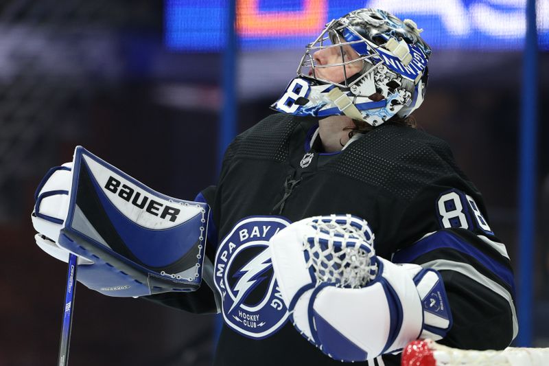 Feb 17, 2024; Tampa, Florida, USA;  Tampa Bay Lightning goaltender Andrei Vasilevskiy (88) looks to the scoreboard during a game against the Florida Panthers in the second period at Amalie Arena. Mandatory Credit: Nathan Ray Seebeck-USA TODAY Sports