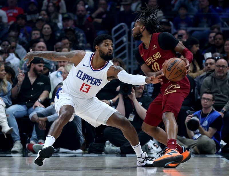 LOS ANGELES, CALIFORNIA - APRIL 07: Darius Garland #10 of the Cleveland Cavaliers is guarded by Paul George #13 of the LA Clippers during the first half at Crypto.com Arena on April 07, 2024 in Los Angeles, California. User is consenting to the terms and conditions of the Getty Images License Agreement. (Photo by Harry How/Getty Images)