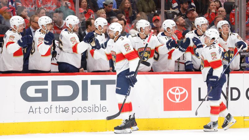 Mar 22, 2025; Washington, District of Columbia, USA; Florida Panthers defenseman Seth Jones (3) celebrates with teammates on the bench after scoring a goal against the Washington Capitals during the first half at Capital One Arena. Mandatory Credit: Amber Searls-Imagn Images