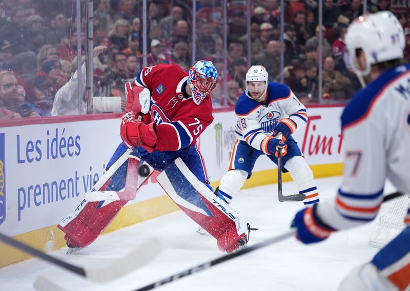 Dec 14, 2025; Montreal, Quebec, CAN; Montreal Canadiens goalie Jakub Dobes (75) clears the puck under pressure from Edmonton Oilers forward Zach Hyman (18) and forward Connor McDavid (97) during the third period at the Bell Centre. Mandatory Credit: Eric Bolte-Imagn Images