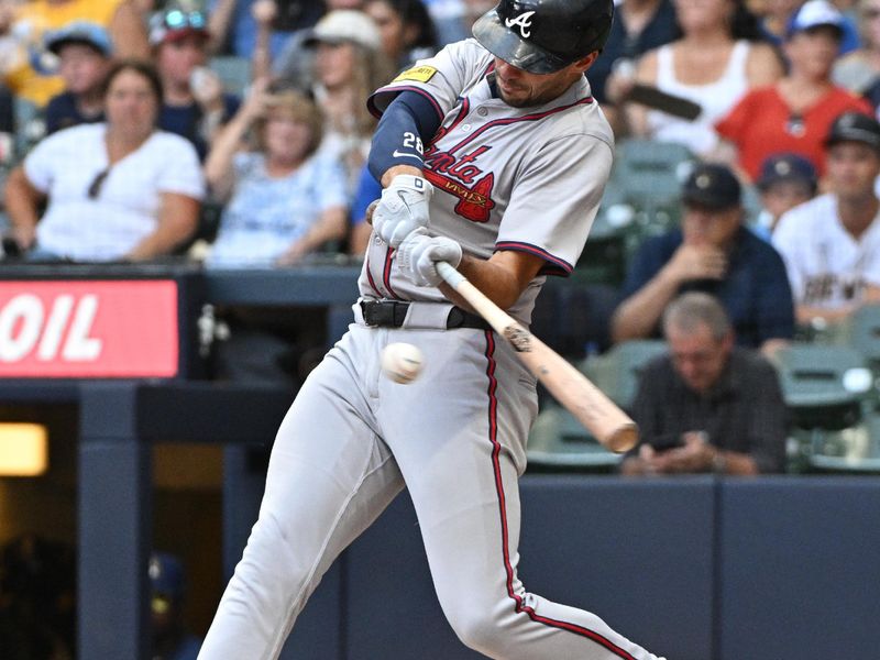 Jul 31, 2024; Milwaukee, Wisconsin, USA; Atlanta Braves first base Matt Olson (28) hits a home run against the Milwaukee Brewers in the fourth inning at American Family Field. Mandatory Credit: Michael McLoone-USA TODAY Sports
