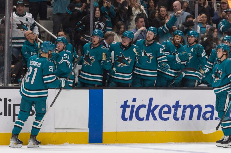 Nov 22, 2025; San Jose, California, USA;  San Jose Sharks center Alexander Wennberg (21) celebrates with his team after scoring a goal during the second period against the Ottawa Senators at SAP Center at San Jose. Mandatory Credit: Stan Szeto-Imagn Images