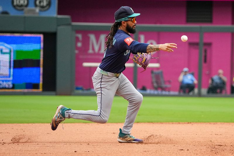 Sep 18, 2025; Kansas City, Missouri, USA; Seattle Mariners shortstop J.P. Crawford (3) fields a ground ball against the Kansas City Royals and throws to first for an out in the sixth inning at Kauffman Stadium. Mandatory Credit: Denny Medley-Imagn Images